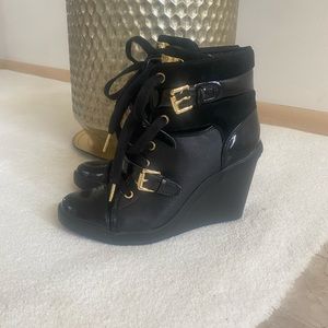 Michael Kors black wedge booties with gold buckle detailing. size 8.